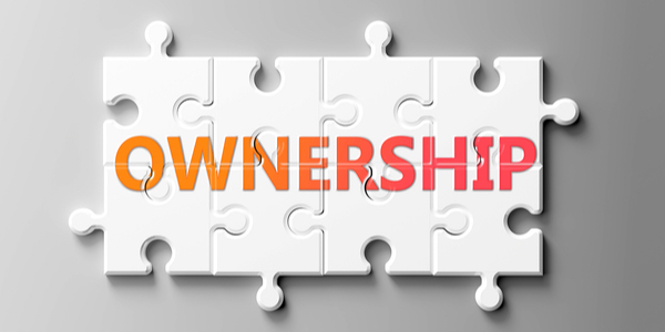 Ownership written on an eight piece jigsaw