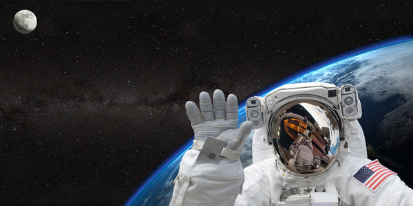 Hello world. Astronaut waving from space above the earth