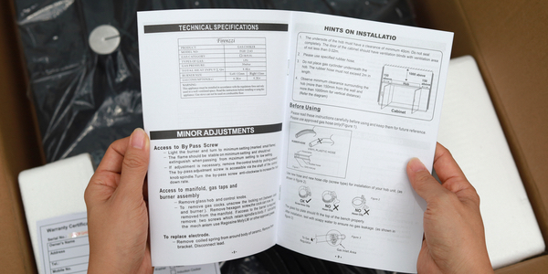 Open instruction manual over some equipment